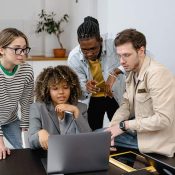 Group reviewing printed documents and planning materials for ISO climate amendment